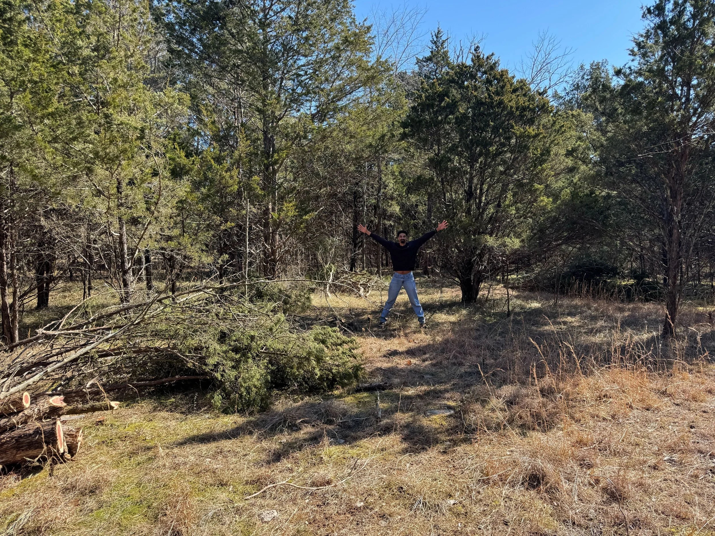 Matthew triumphant behind cedar_Stones River_2.13.2026.jpg