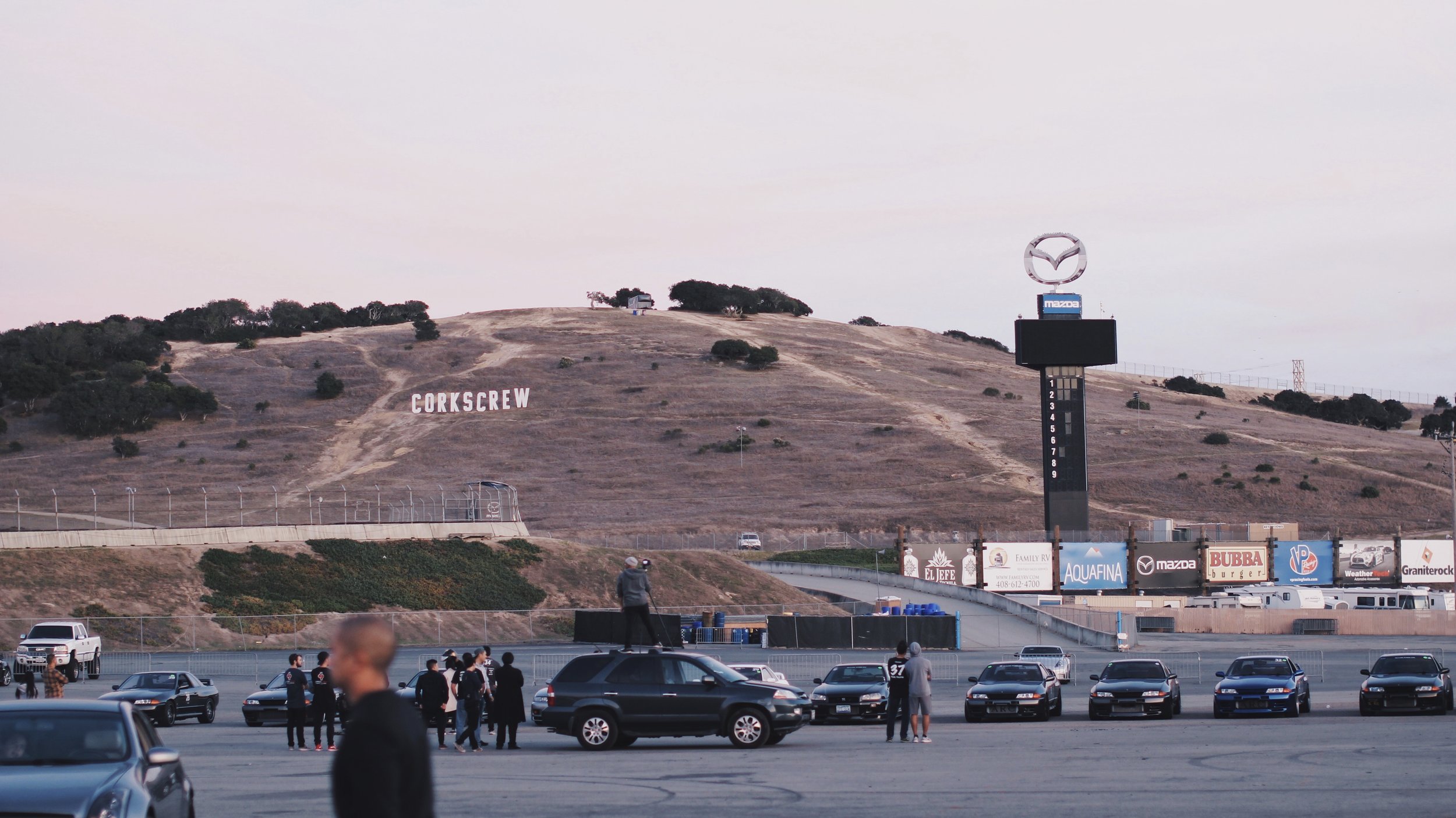 I couldn't sleep the whole night since I have been very anxious about the event. We all woke up at 7 am to quickly get ready for the big day. As I was rolling into Laguna Seca, I had a moment feeling that I have been here before. Of course, I knew it was my first time, but it was a powerful experience of déjà vu from my GrandTurismo gaming days since the PS1 era. Being at Laguna Seca in person was a remarkable and unforgettable experience. The track is very spacious and I've seen nothing like this back home. And here is a pit garage I rented for my car and equipments. 