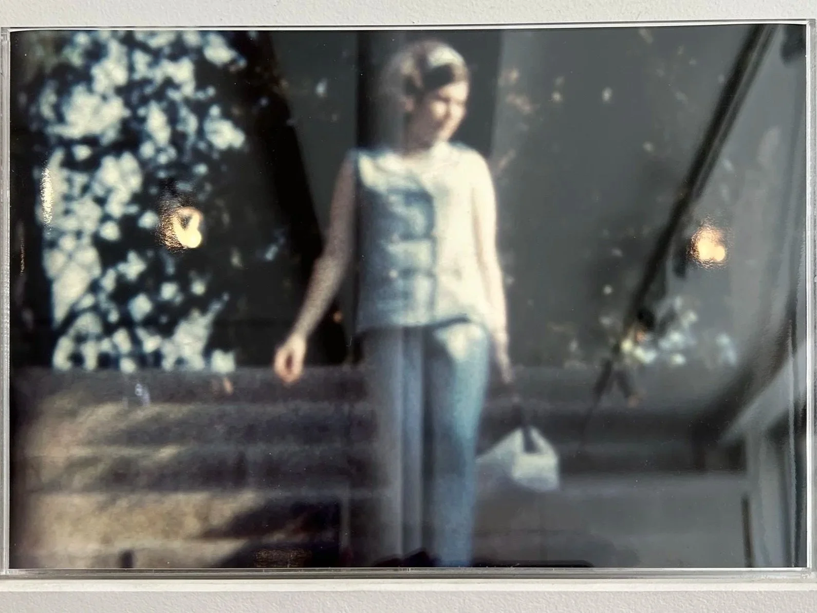    Home Movie Stills , 2025  Plexiglass box, glossy prints, textile fragment, playlist (three generations), pastel drawing. 