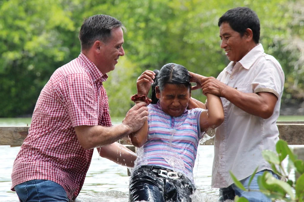 Edmund baptising his daughter