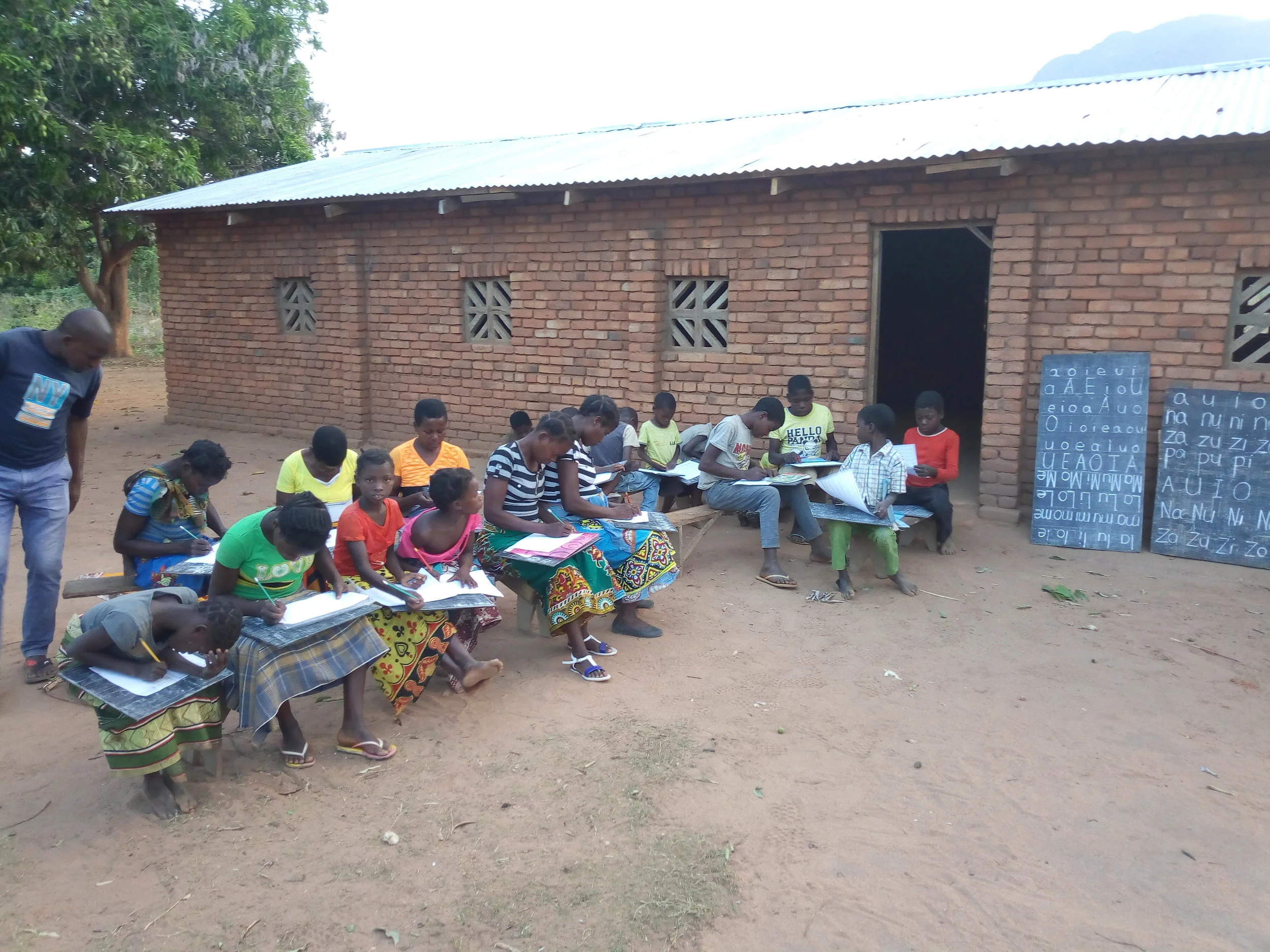 Yolo youths having an outdoor literacy lesson