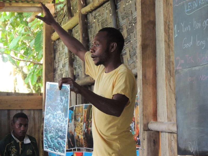 Mengen man teaching a Bible lesson