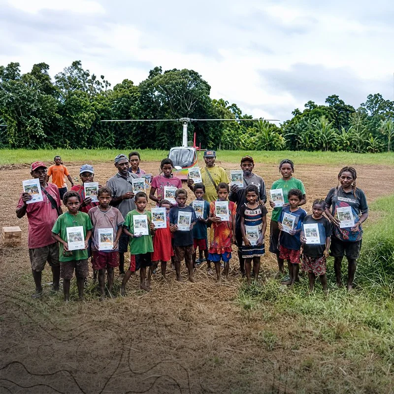 Aviation Bridges the Gap: Inapang Children Receive Scripture Portions and Learn to Read