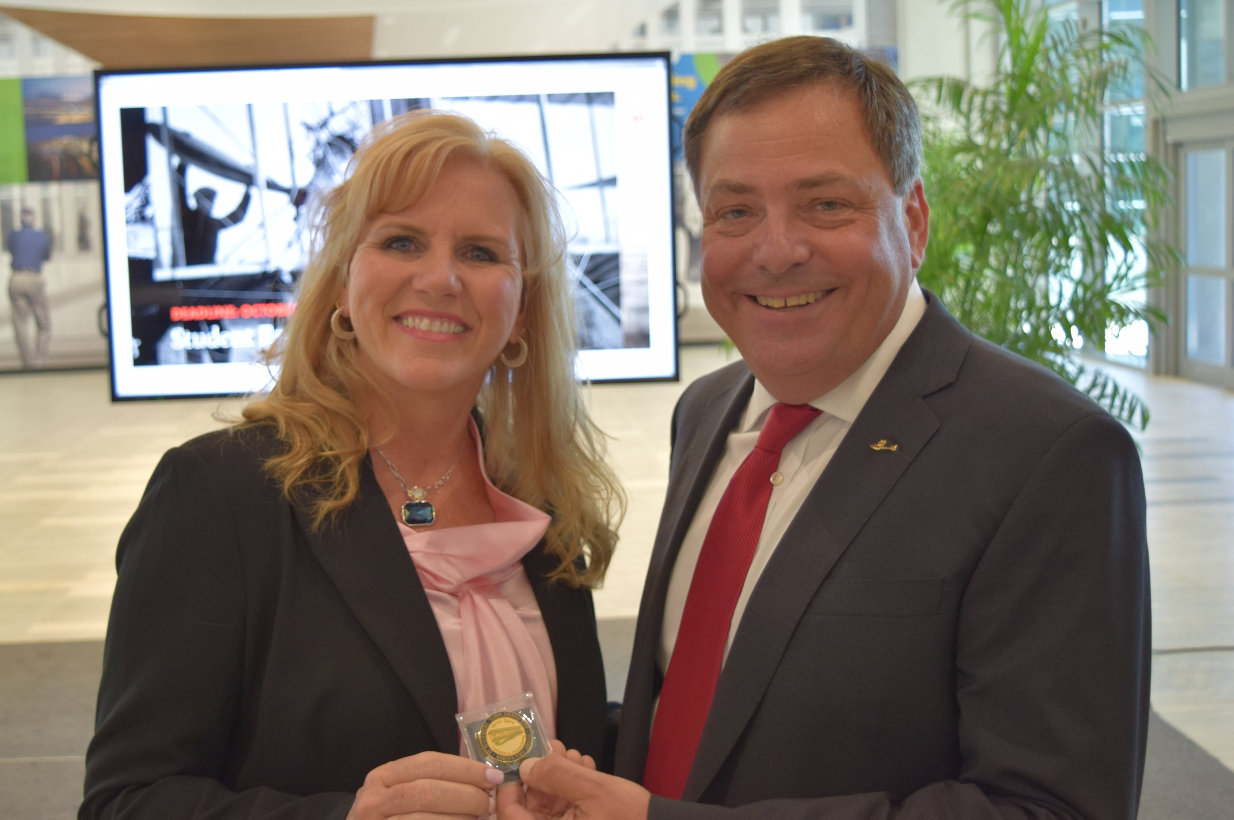 Paul Piro presenting Tony Jannus Centennial Coin to Jeannie Driscoll after Press Conference, 9 May '17.JPG