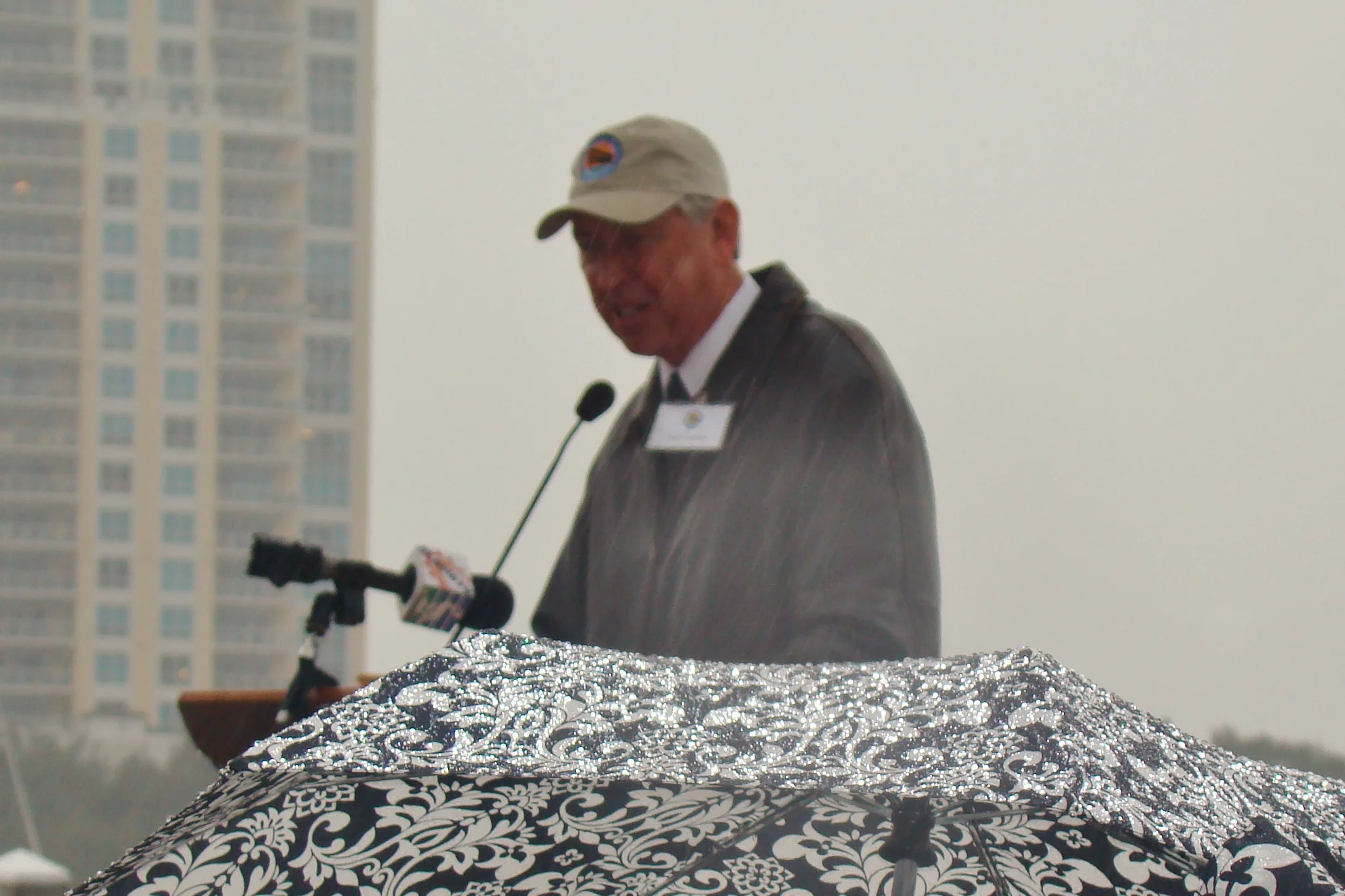 Will Michaels addressing crowd in rain, 1 Jan '14.JPG