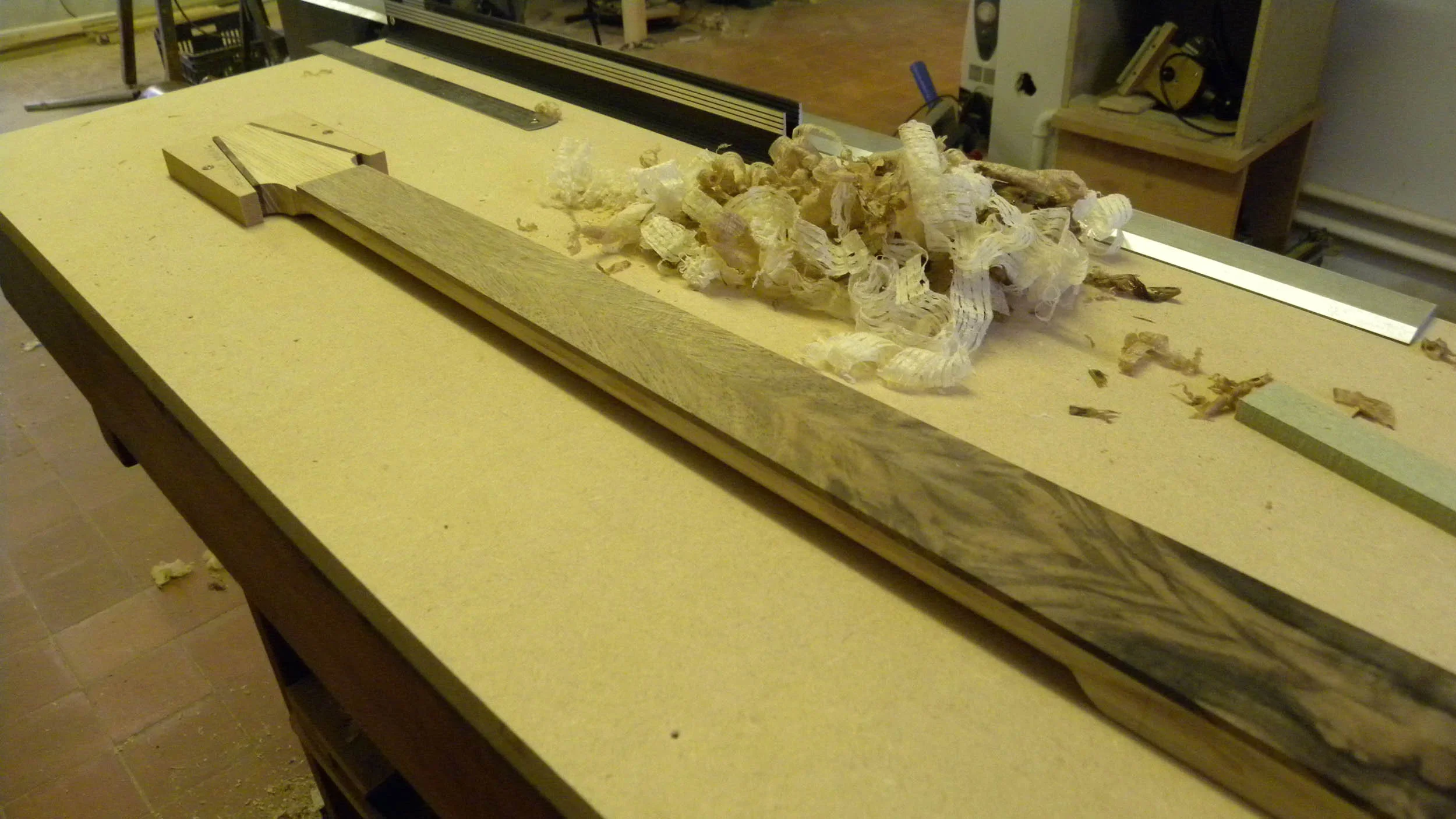 0730 naiad1 planing fretboard ni web.jpg
