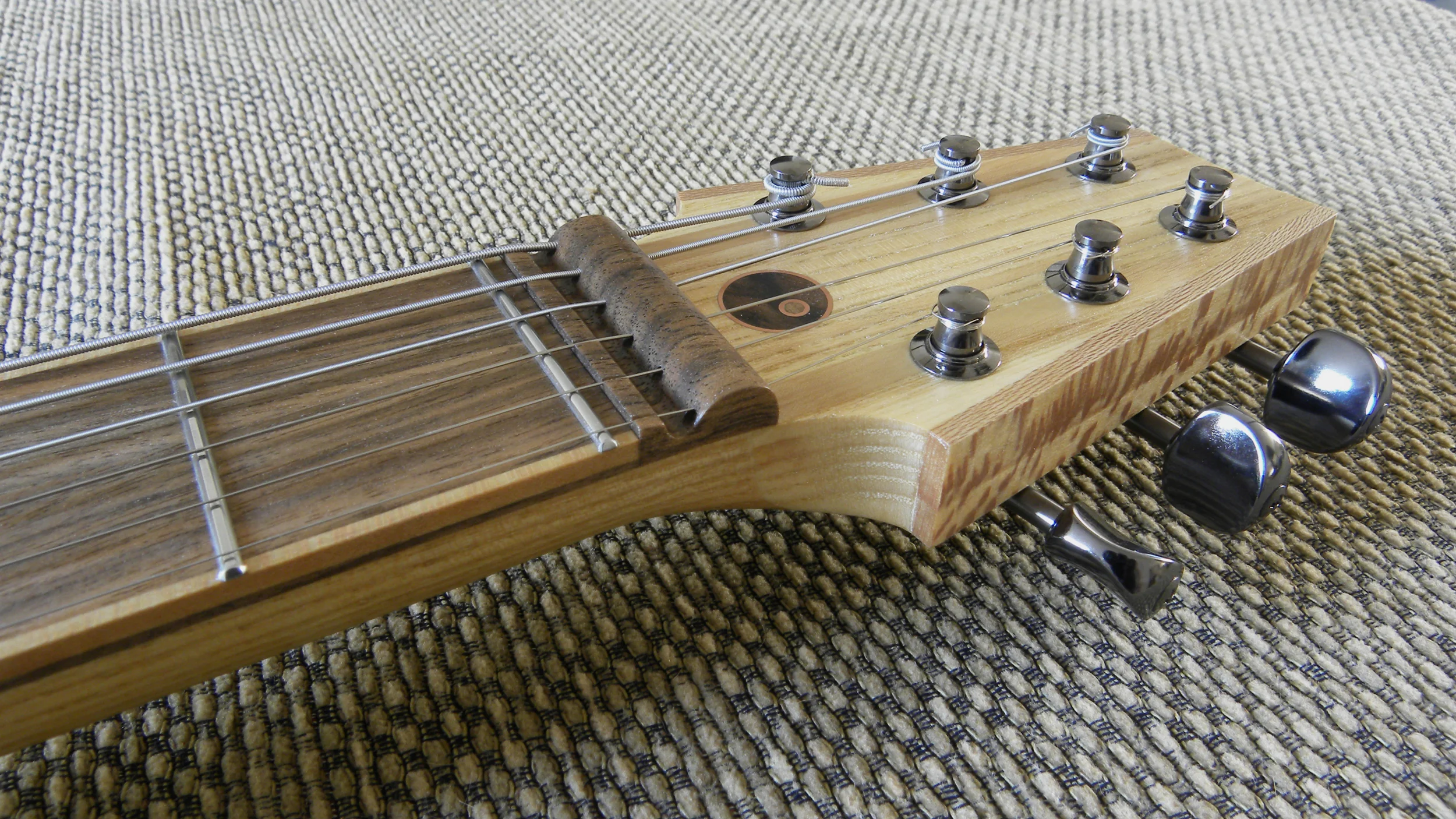 Halflight Guitars 'Naiad' English Lacewood 2017 headstock angle w.jpg