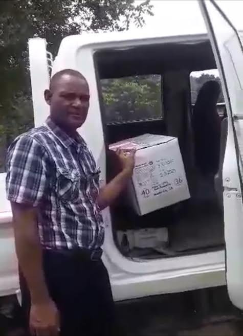 El Schilo's Ram - head of orphanage recieves food.jpg