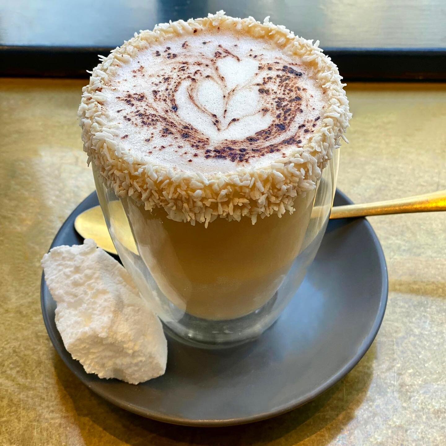 Looks like our new limited edition hot chocolate has landed in the nick of time - our Raffaello Hot Chocolate is new for the autumn and just the thing to keep you cosy on a rainy day like this!

It's creamy 33% Ivory Coast white chocolate, foamed Mos