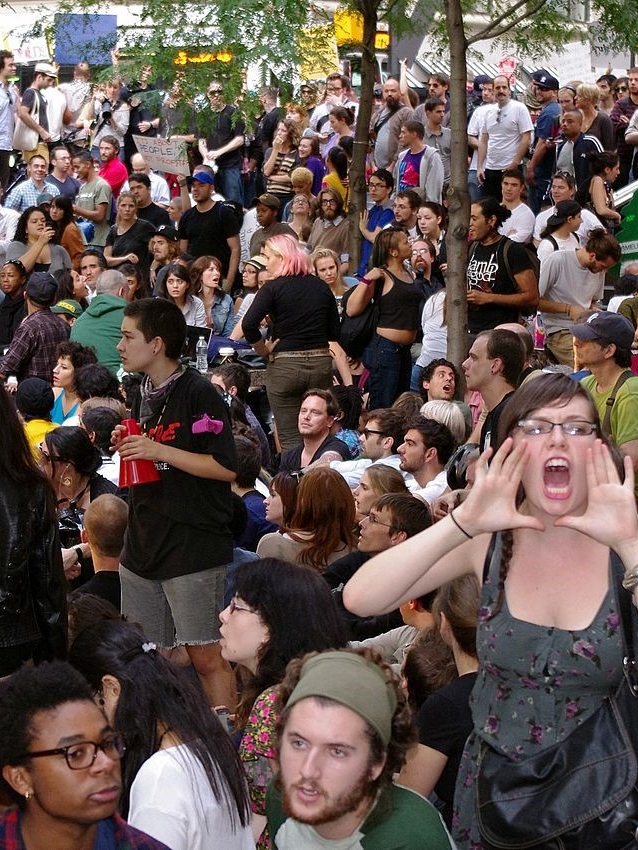 Occupy Wall Street General assembly at Zuccotti Park (New York, 2011) (Source: Wikimedia Commons. Available online: https://commons.wikimedia.org/wiki/File:Day_14_Occupy_Wall_Street_September_30_2011_Shankbone_2.JPG Last accessed: June, 2017)