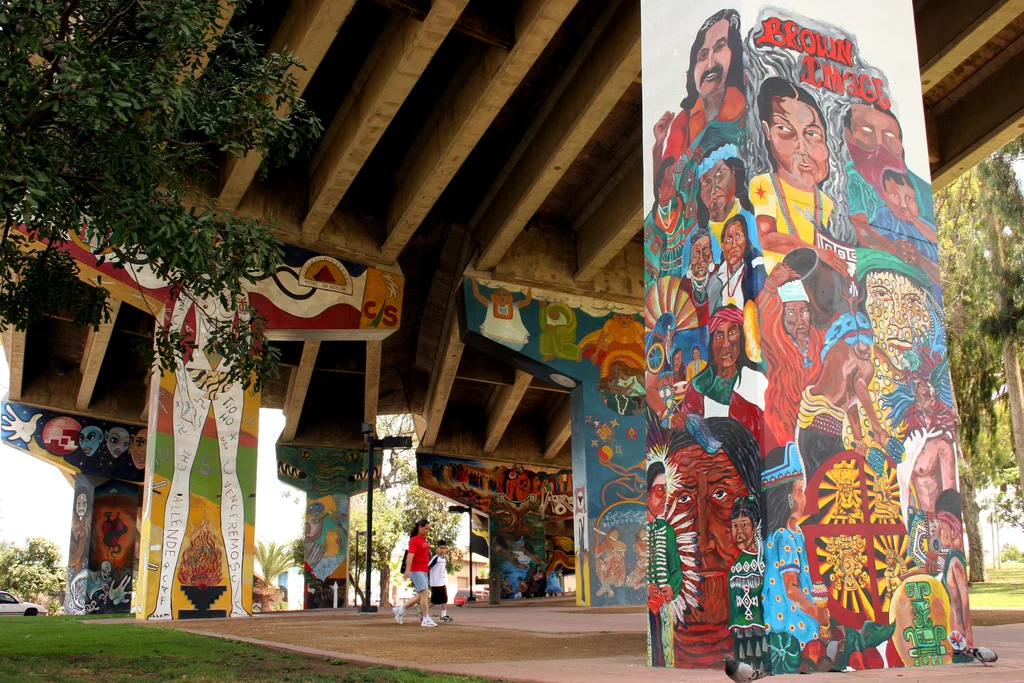 Chicano Park in San Diego is an example of a tactical intervention in an elevated highway. This murals were made by Mexican-American Activists during the occupation of the space in the 1960s. Description: Chicano Park Murals. Author: Kellinahandbasket. August 10 2006, San Diego, CA. Registered under a Creative Commons 2.0 license. Available in Flickr.