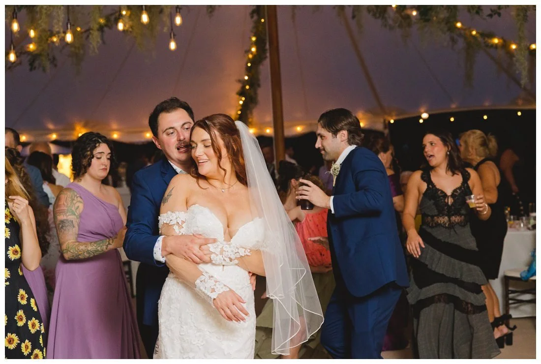 bride and groom dancing at wedding reception party