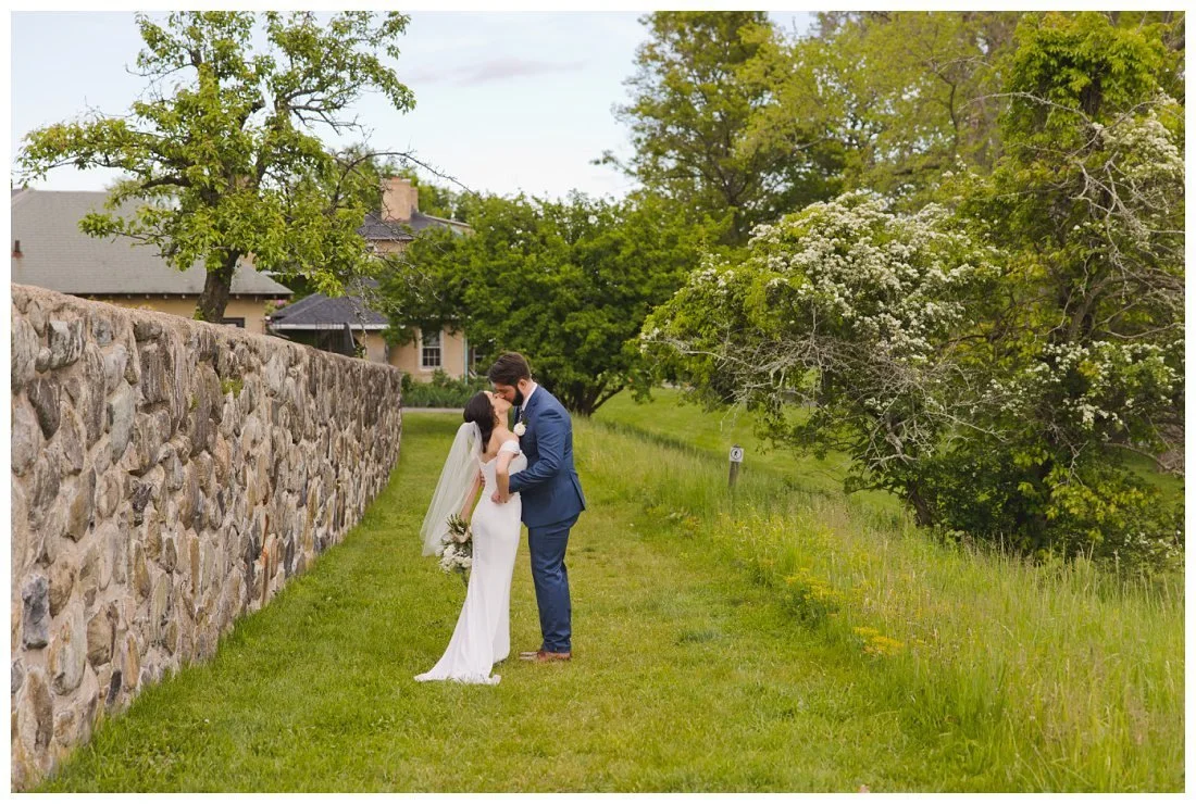 mira and jon kiss after their wedding recessional on the way to cocktail hour