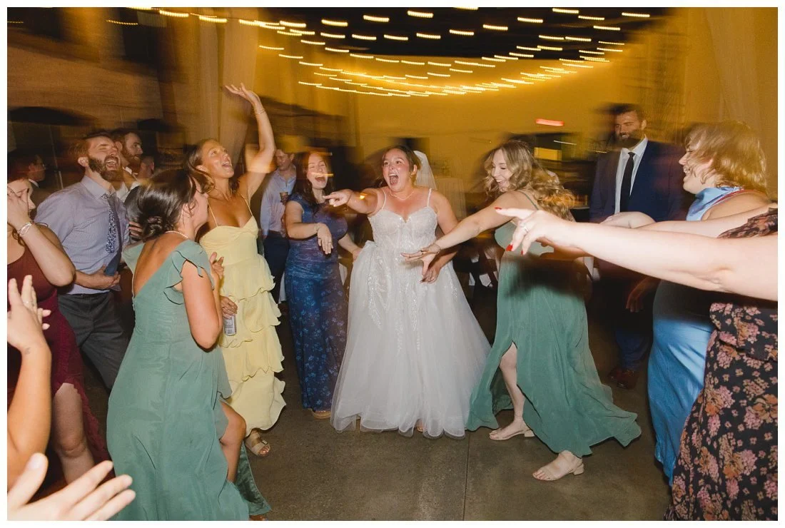 natalie surrounded by friends on the dance floor