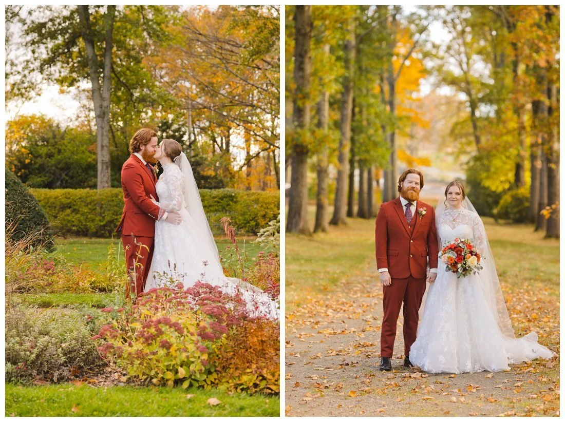 bride and groom kiss with fall foliage behind them in green field; couple holds hands on tree lined pathway