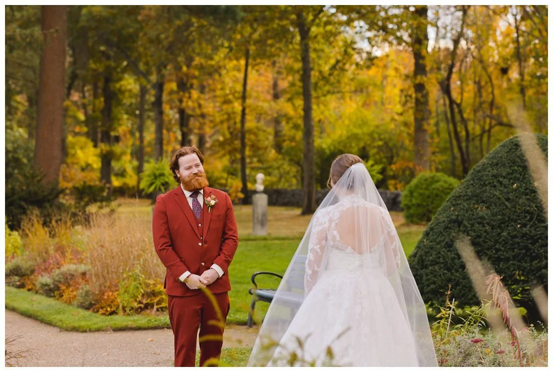 andrew smiles lovingly at emma during first look