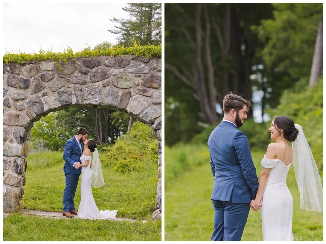 bride and groom kiss under the stone arch at the barn at crane estate