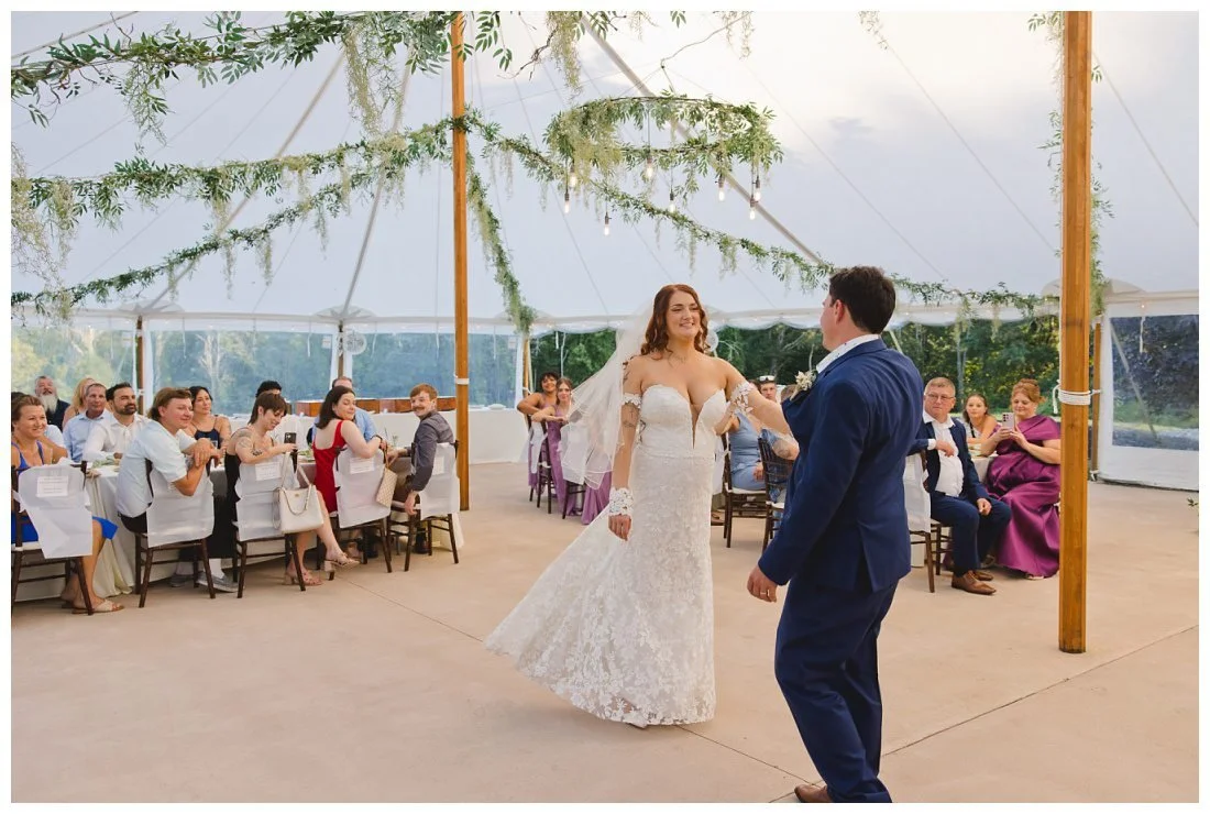 first dance with wide angle of the tent and bridal twirl