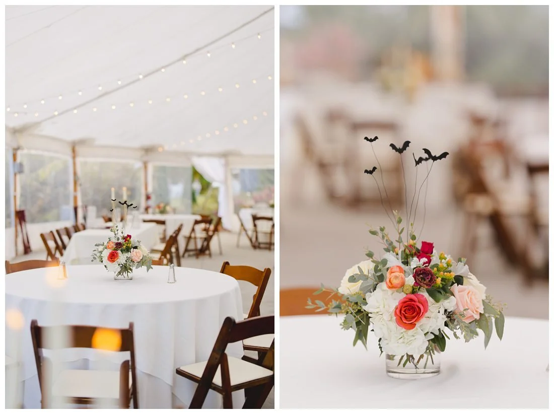 wedding floral centerpieces with white, pink and orange flowers, with a hint of halloween with little bats coming out of them