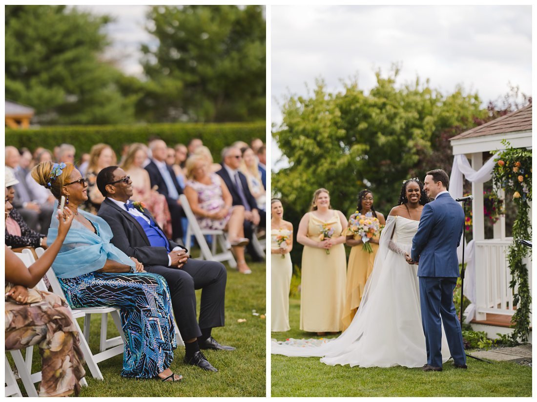 bride's parents look at the wedding couple during ceremony and smile widely