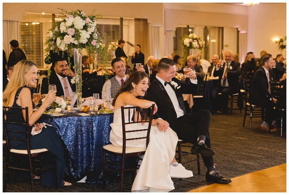rachel gives a surprised laugh at the end of her sister's wedding toast