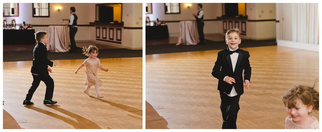 kids running around the dance floor having fun during wedding reception