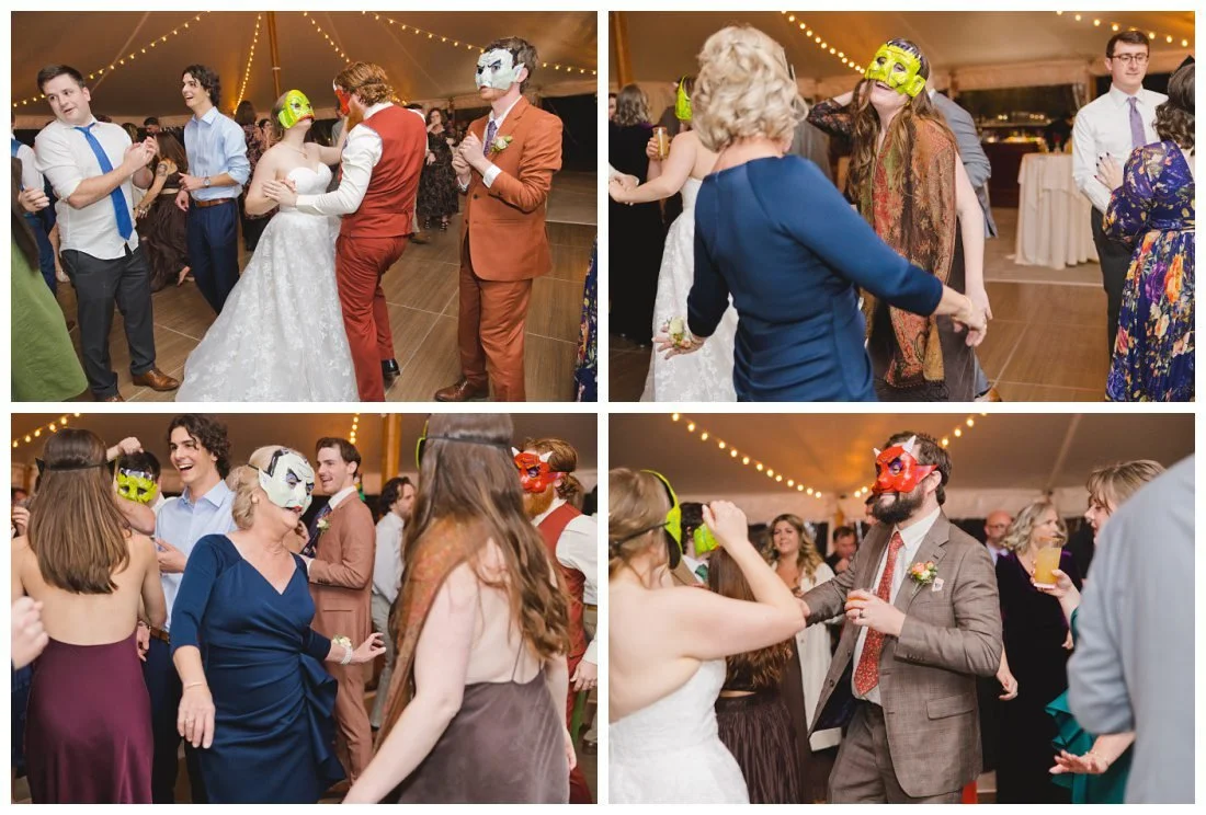 guests wear homemade halloween masks while dancing at wedding reception