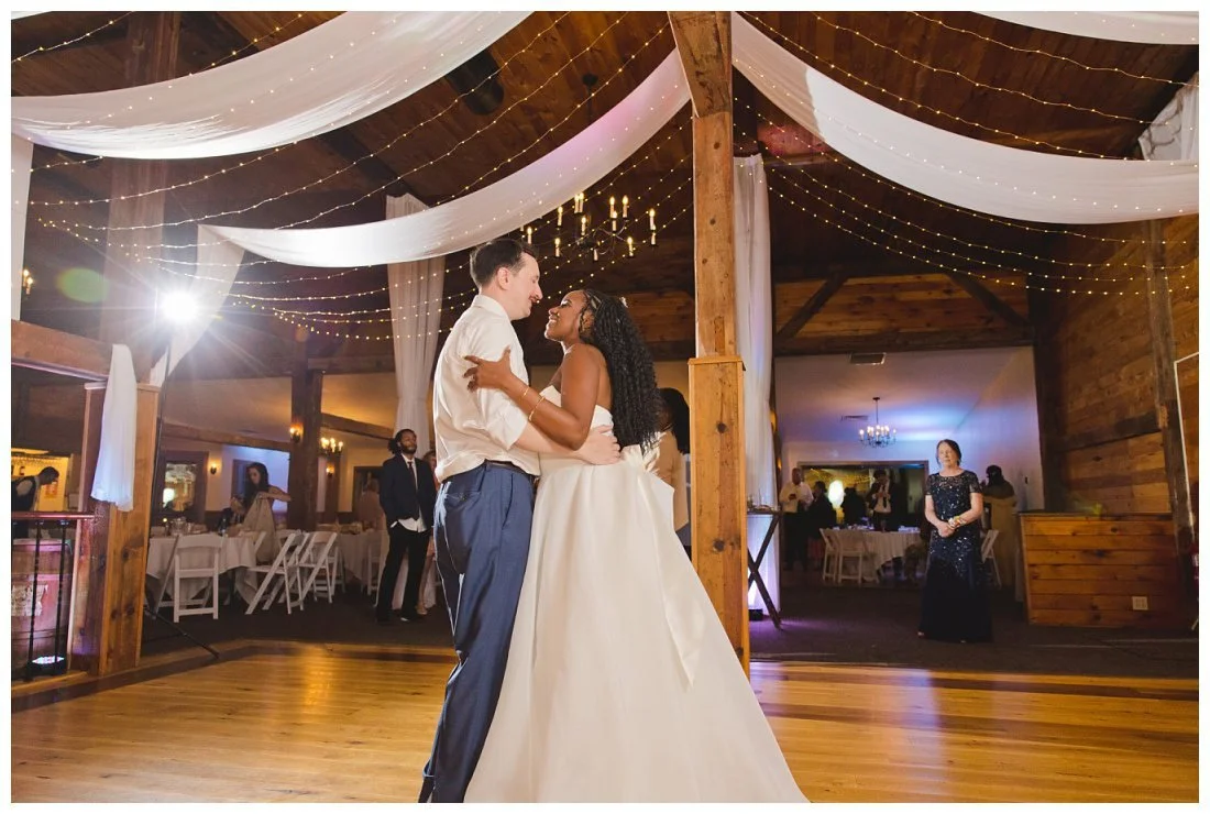 last dance at wedding reception at dell lea with little twinkling lights above them
