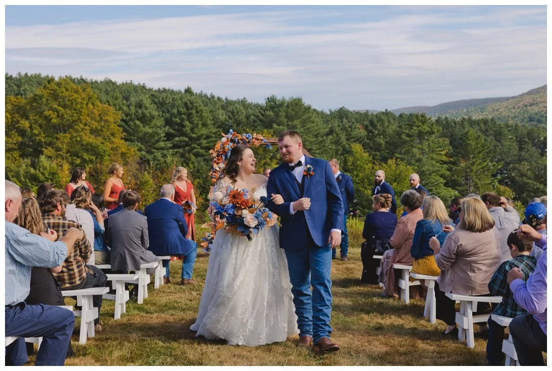 bride and groom laughing wihle coming back down the aisle after saying i do