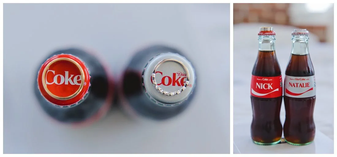 coke and diet coke bottles with wedding rings on top