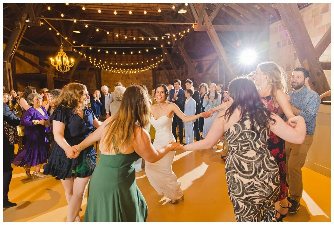 bride dances with her friends for the hora