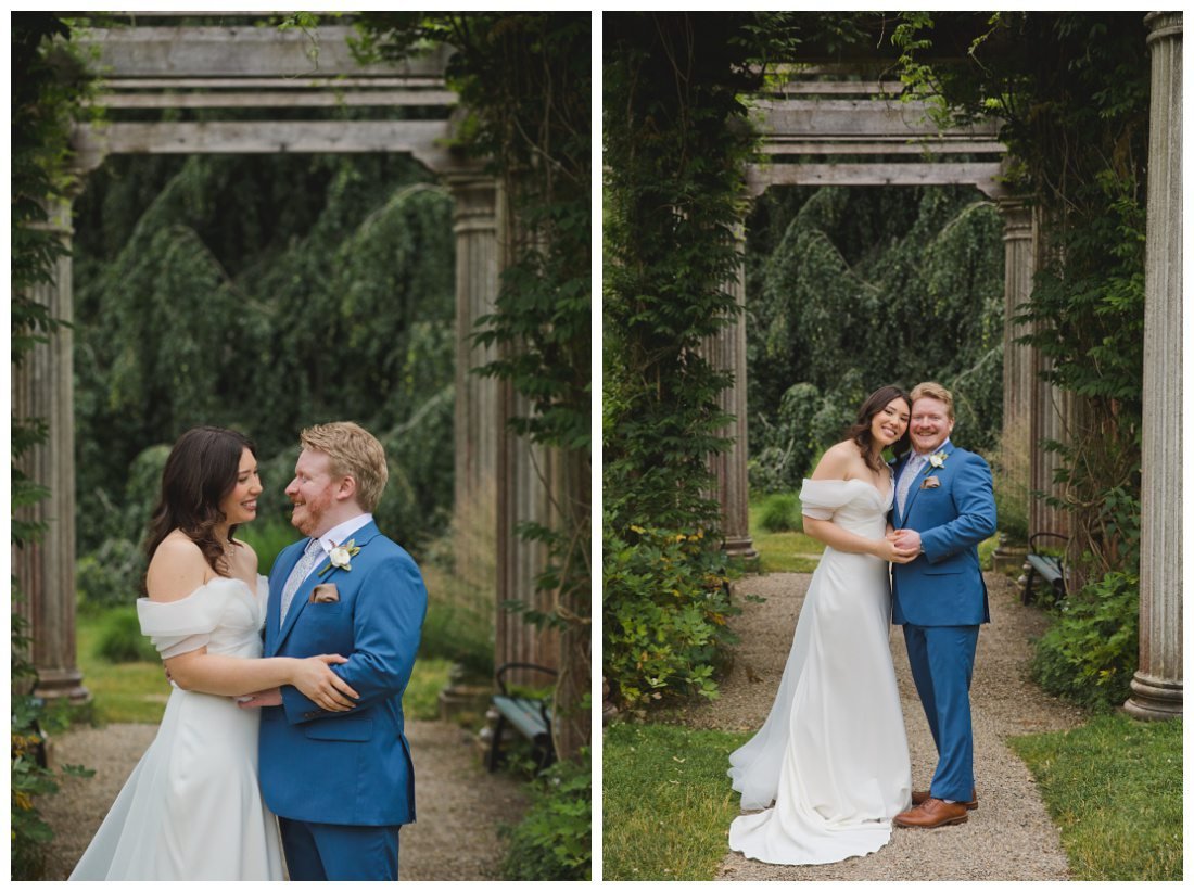 bride and groom formal wedding photos under architectural arch with wisteria