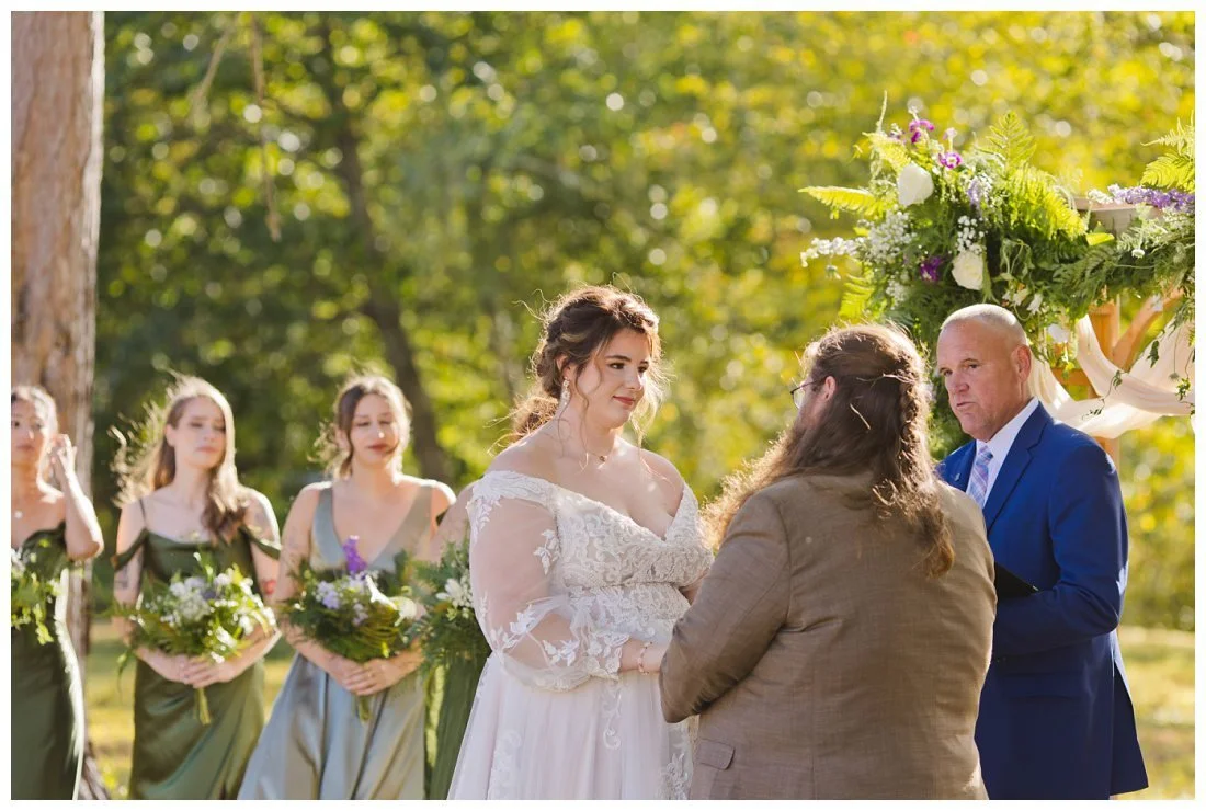 close up of liz looking at john during wedding vows