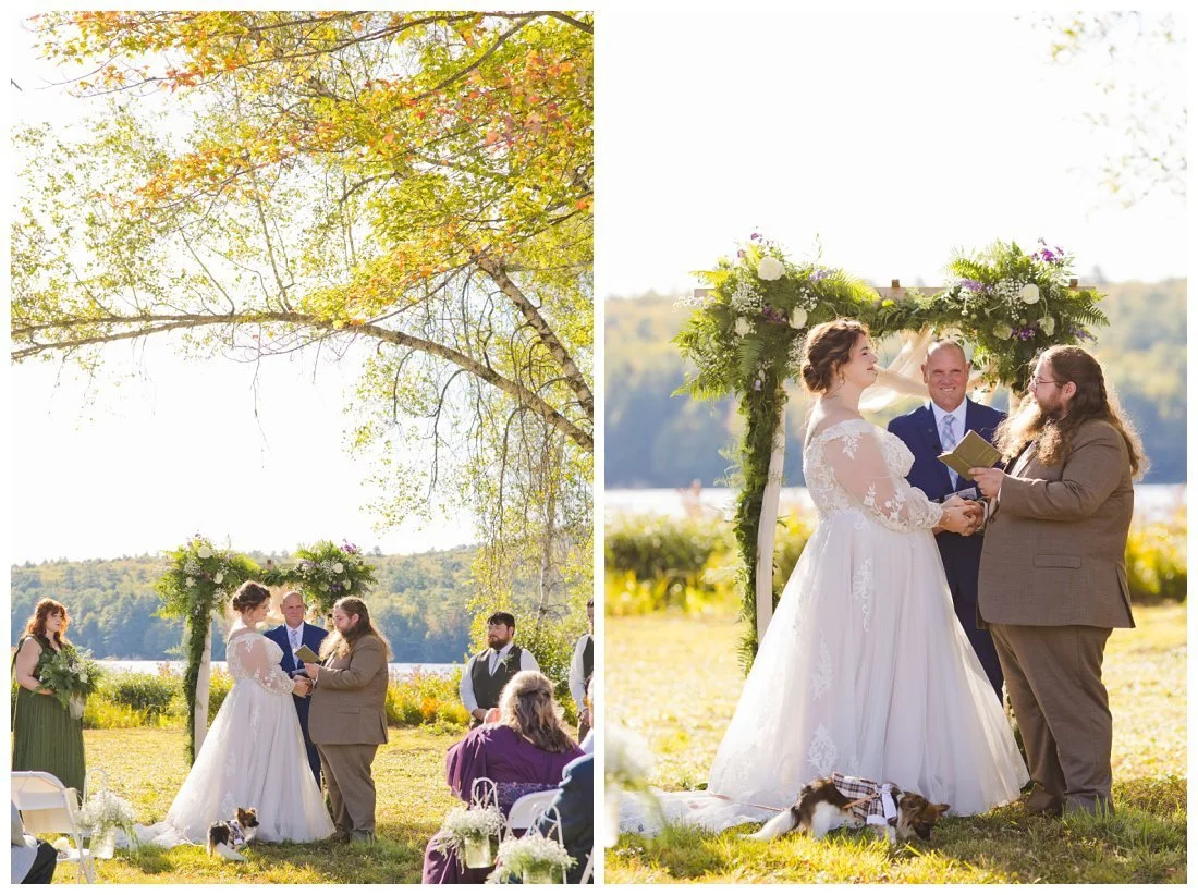 groom reads his vows from vow book to bride and she smiles, with her dog by her side