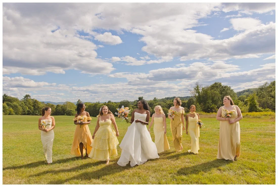 bride walks her bridesmaids while talking and laughing