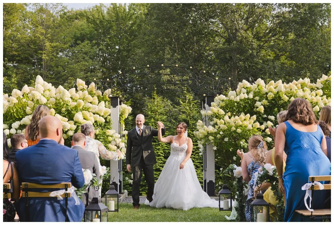 lauren and derek cheer as they're coming back down the aisle after ceremony