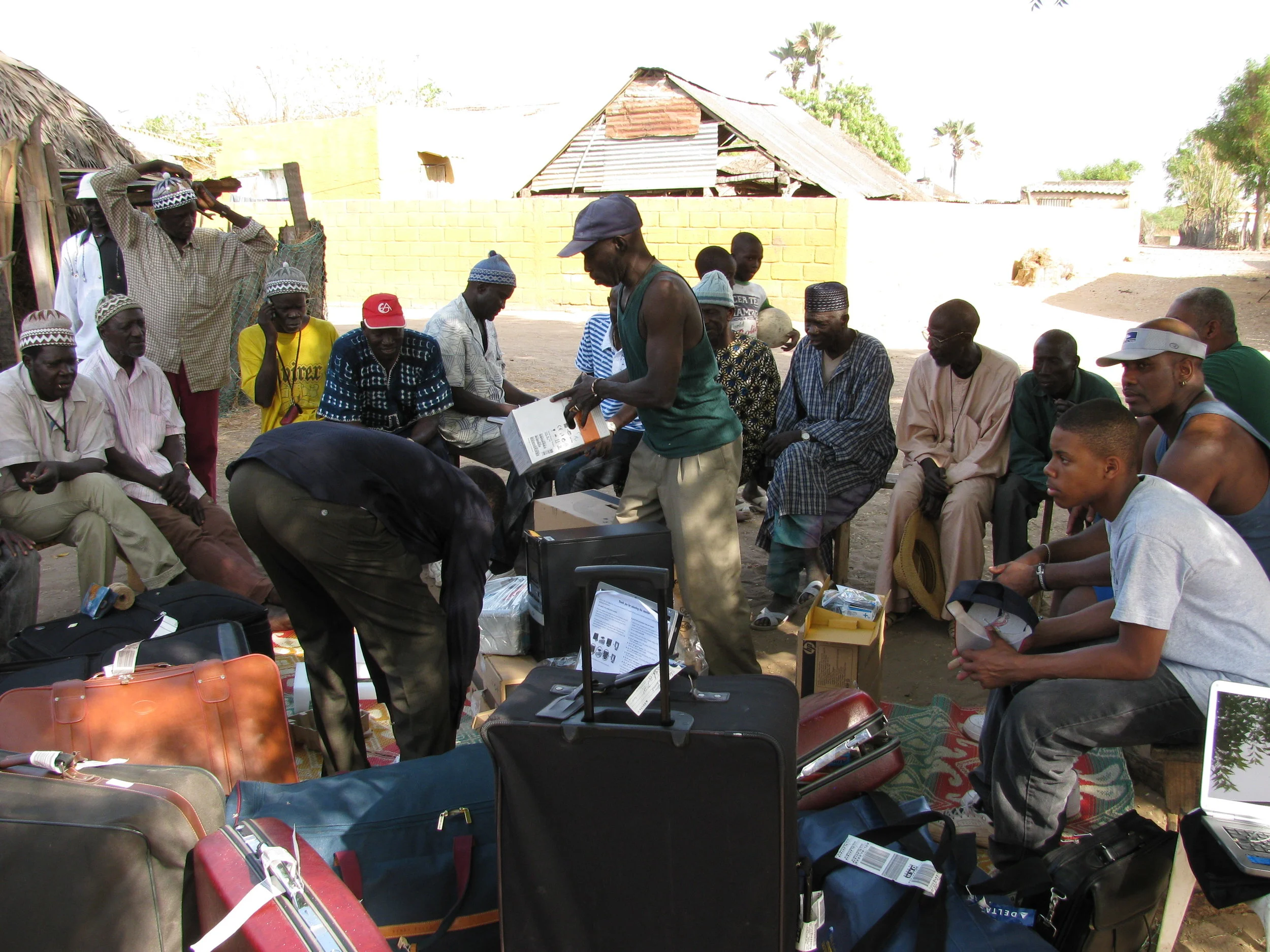 Village leaders gathered to receive donations based on needs requested from the P2 Education Foundation.