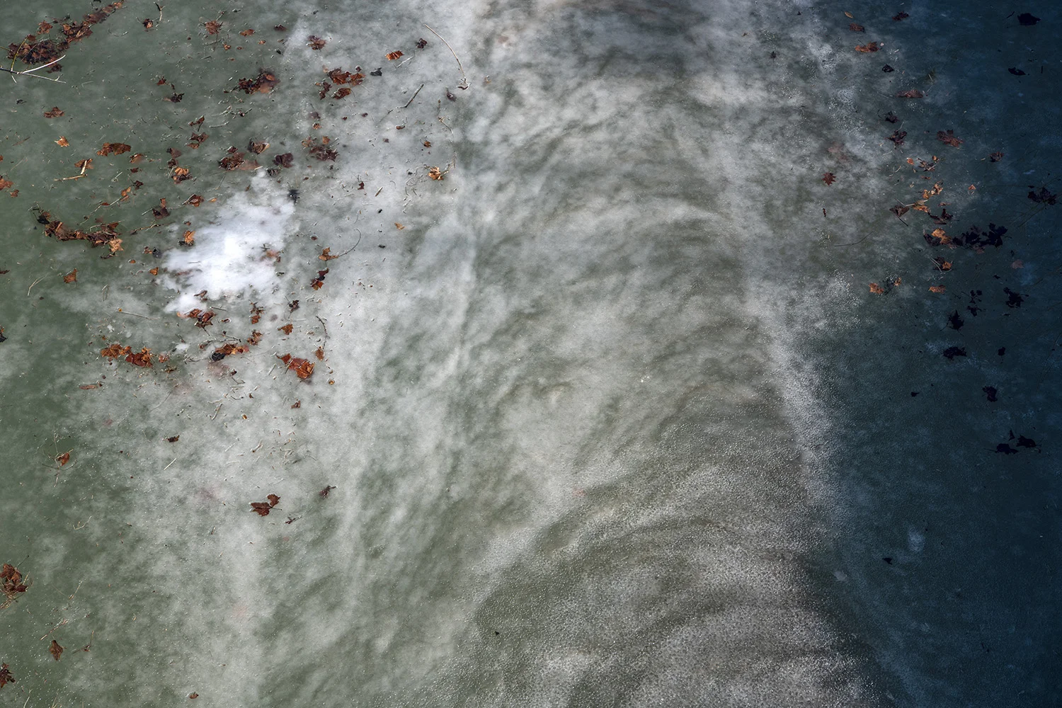  Frozen air bubbles and water flow can be seen in the icy east branch of the Shade River. Several branches of the Shade River run through the area surrounding Tuppers Plains, providing water for farm irrigation over the years but far enough from most