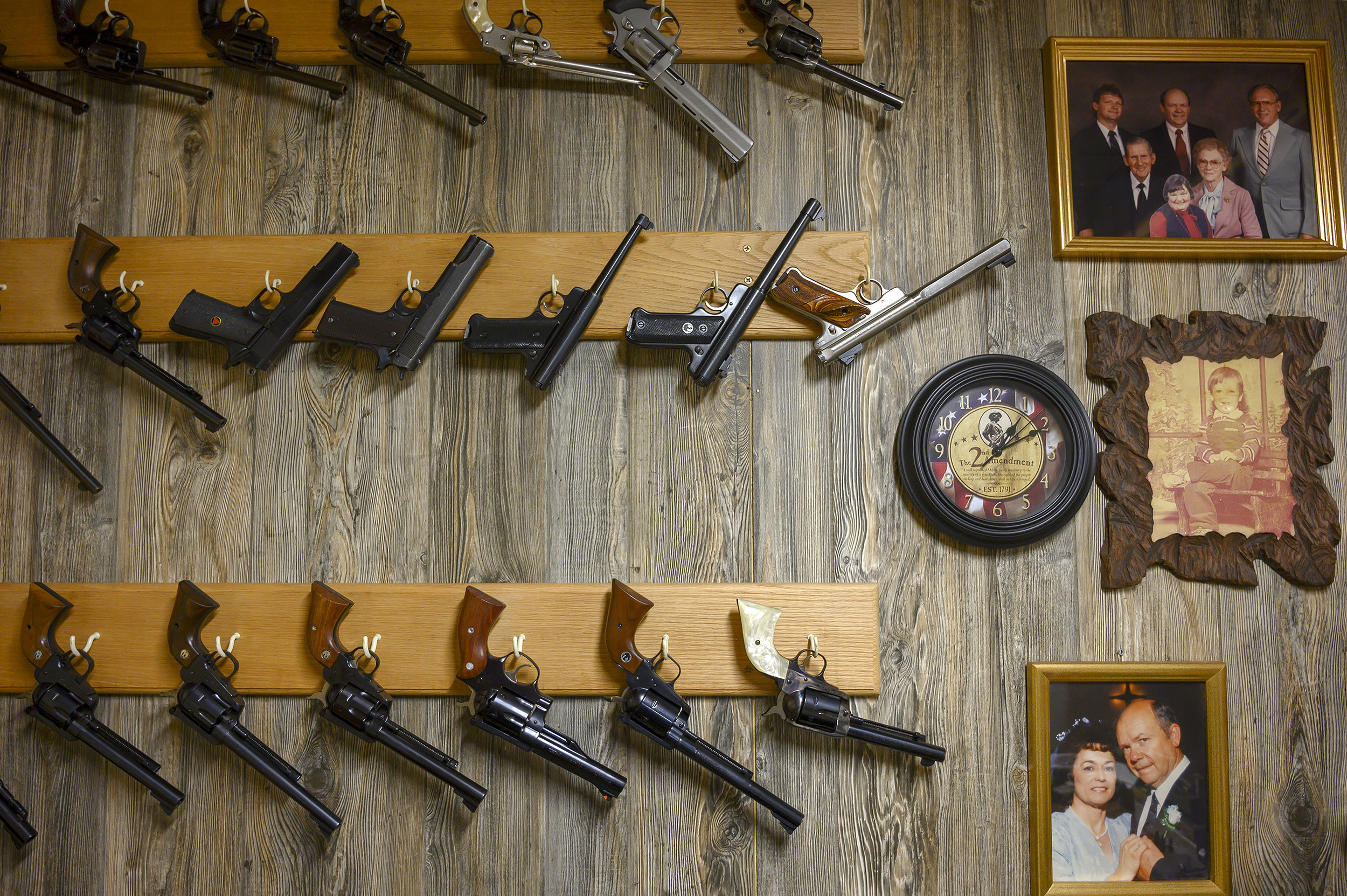 Pistols hang beside family pictures at the home of local musician Harry Gorrels in Tuppers Plains.