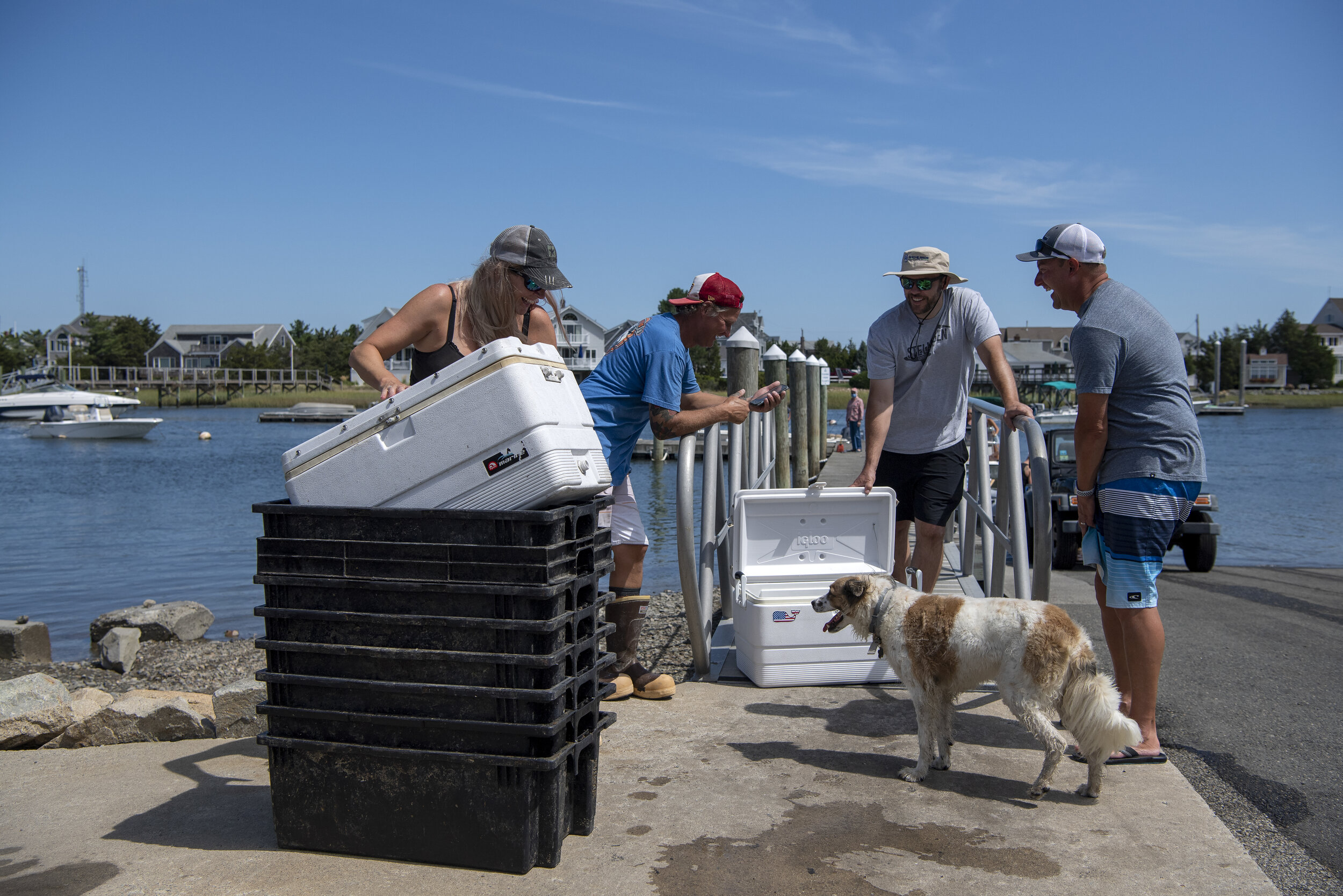 Lobstermen Cara Delaney and Peter Mason sell freshly caught lobster after arriving in Plymouth in the late morning. Using Facebook, Delaney and Mason have been able to reach customers directly, and in doing so, retain the value of lobster that has d