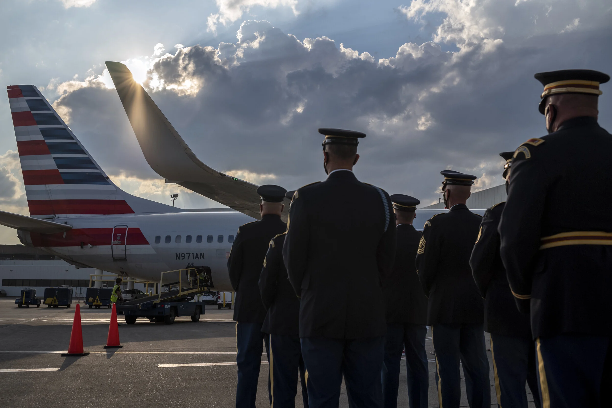 Members of the U.S. Army Honor Guard await the arrival of the American Airlines flight transporting the body of Pfc. William Junior Winchester, one of the last Buffalo Soldiers to enter combat. After 70 years, the family of Pfc. Winchester brought h