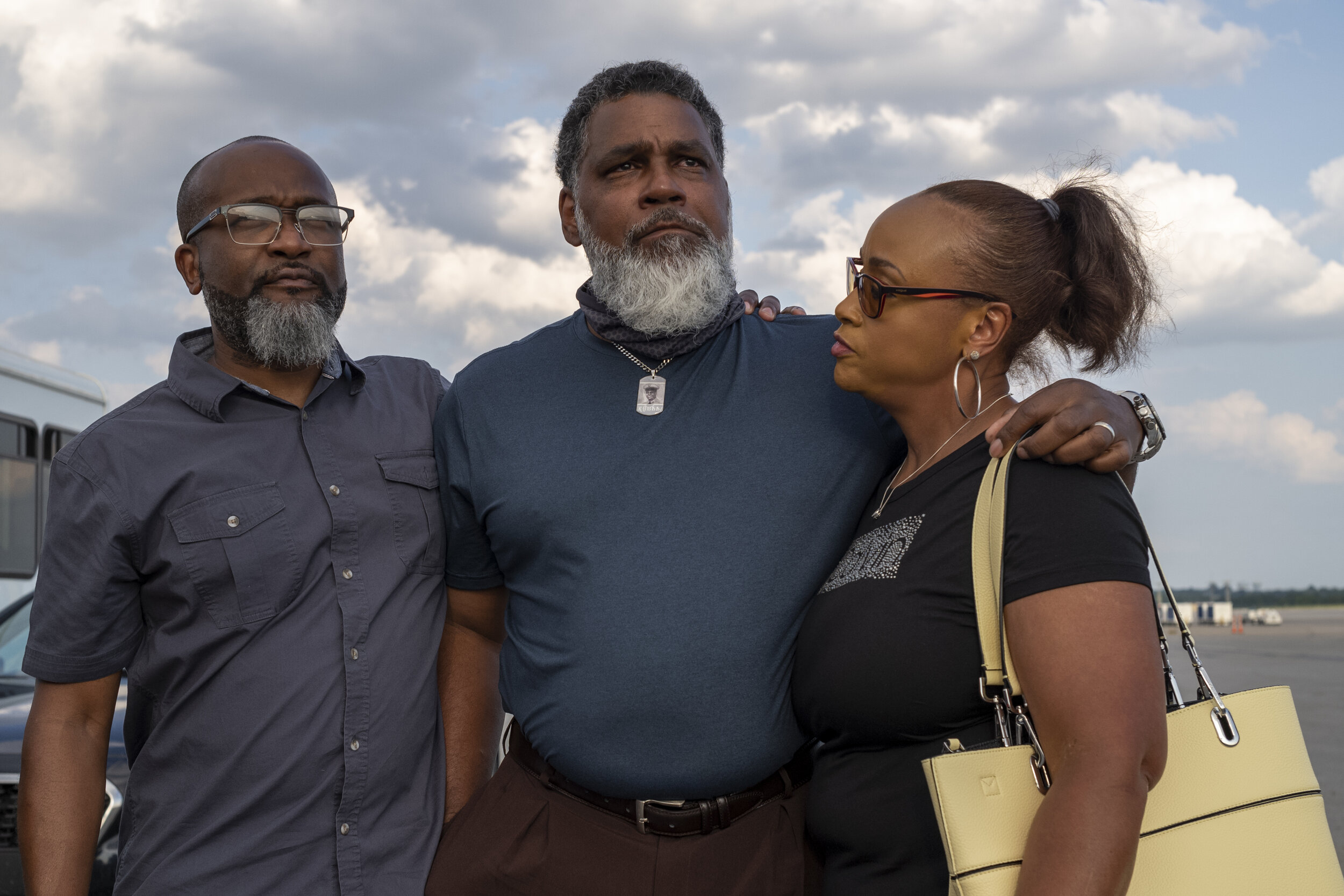  James Winchester, center, watches as the plane carrying his grandfather taxis up the runway at John Glenn International Airport in Columbus, Ohio.  James Winchester’s journey began in 2001. He never met his grandfather and by the time he began askin