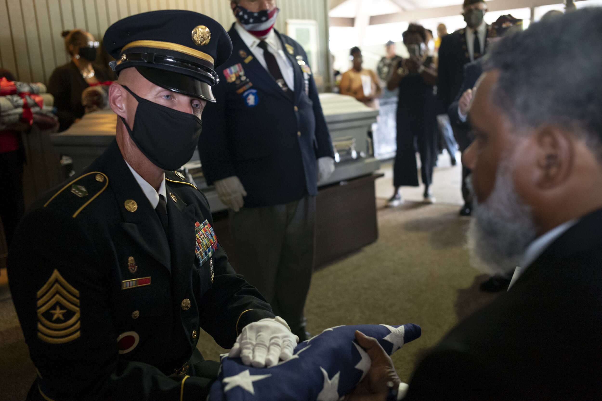  James Winchester is presented with the American flag that was draped over his grandfather’s coffin.  “On behalf of the President of the United States, the United States Army, and a grateful nation, please accept this flag as a symbol of our apprecia