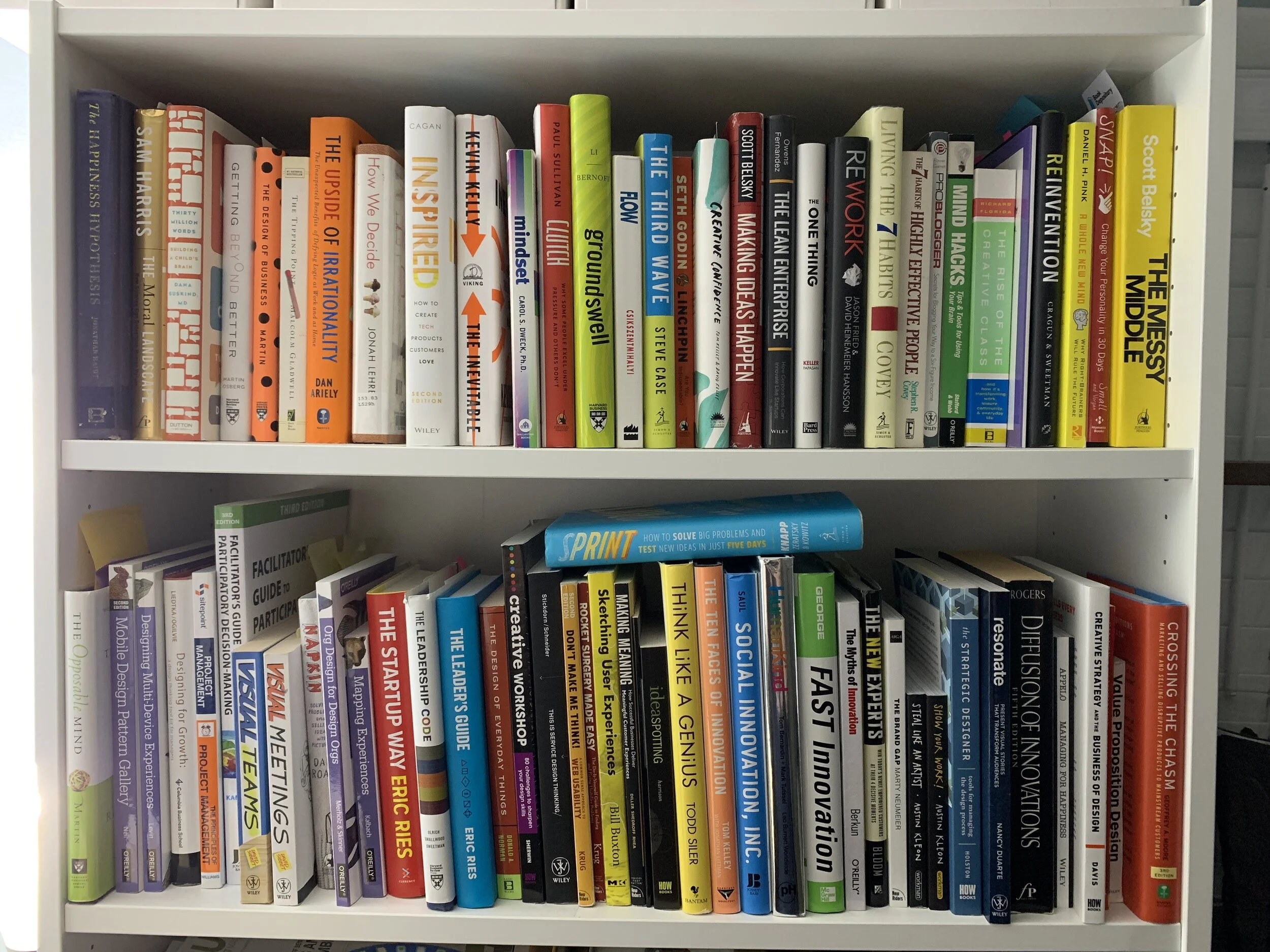 Bookshelf full of books about psychology, design, development and product.