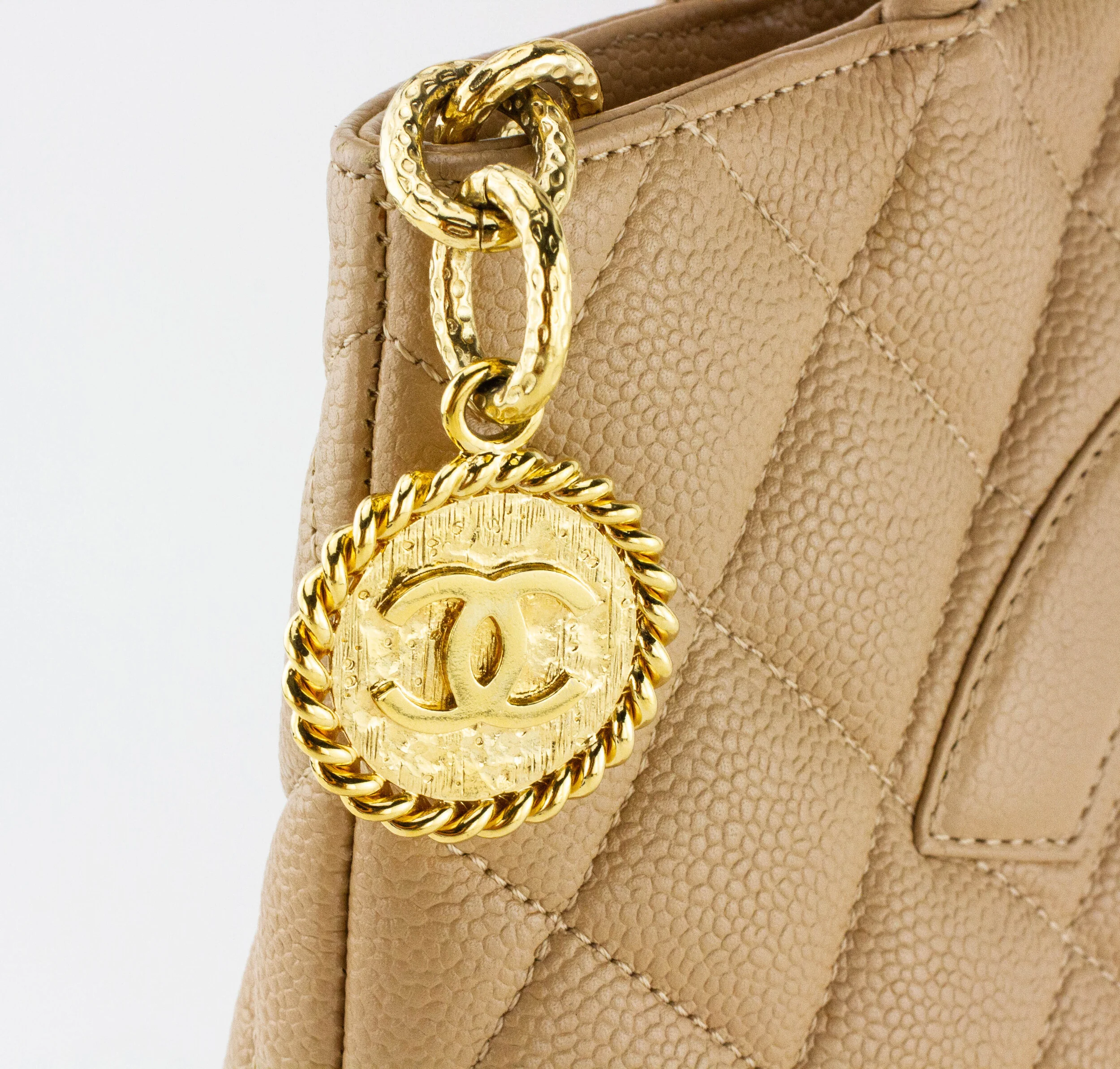 12909-76-CHANEL-tan-quilted-leather-medallion-tote-8.jpg