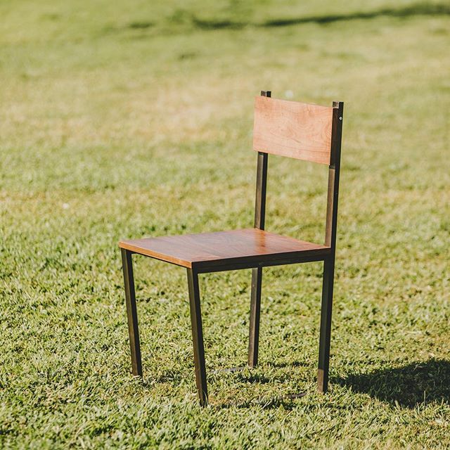 Dining chair in black steel and walnut. Available with wood or leather backs in store and online. #furniture #sandiego