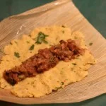 Ready to fold: plantain dough topped with black bean filling (image T.Freuman)