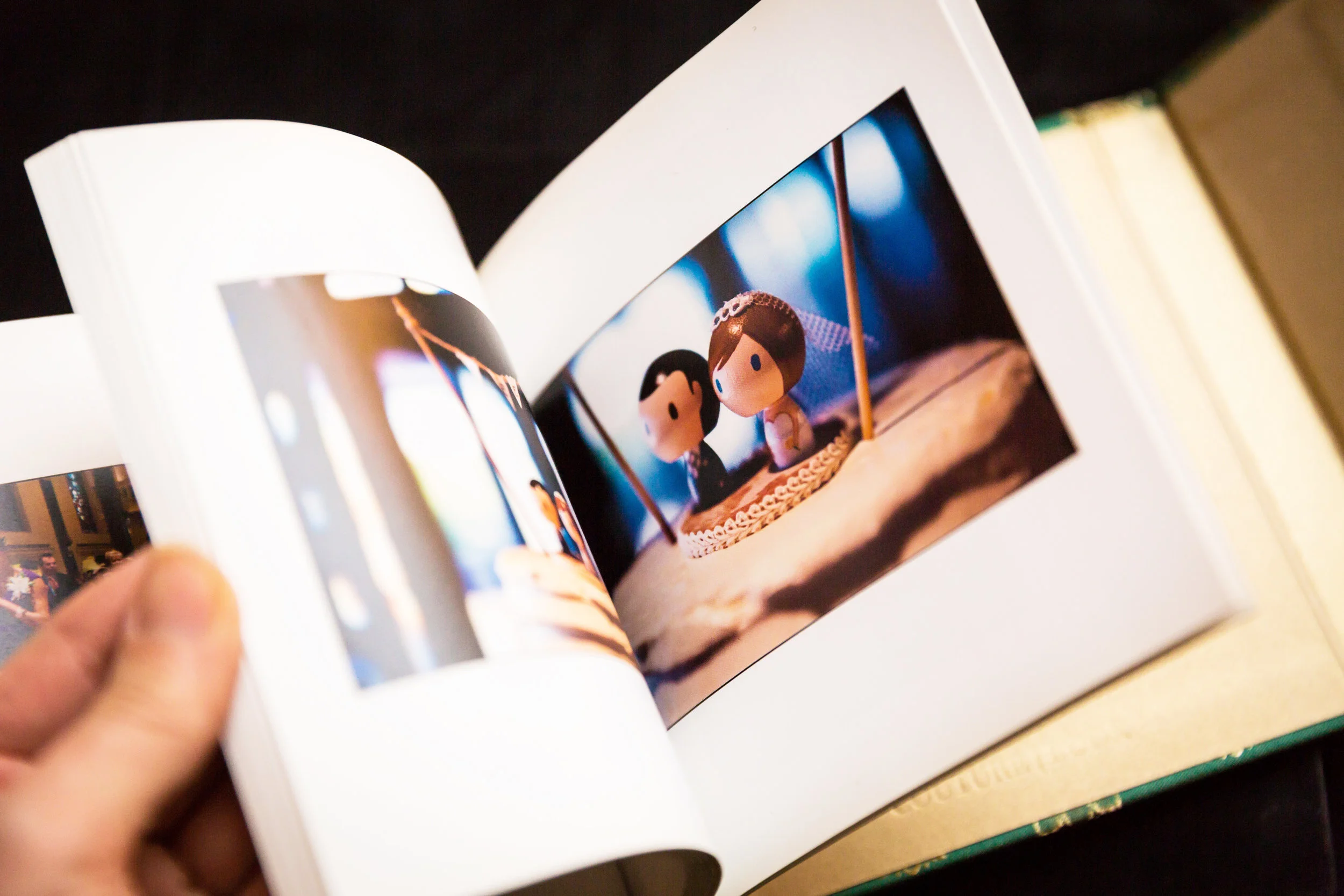 Hand flipping through wedding album