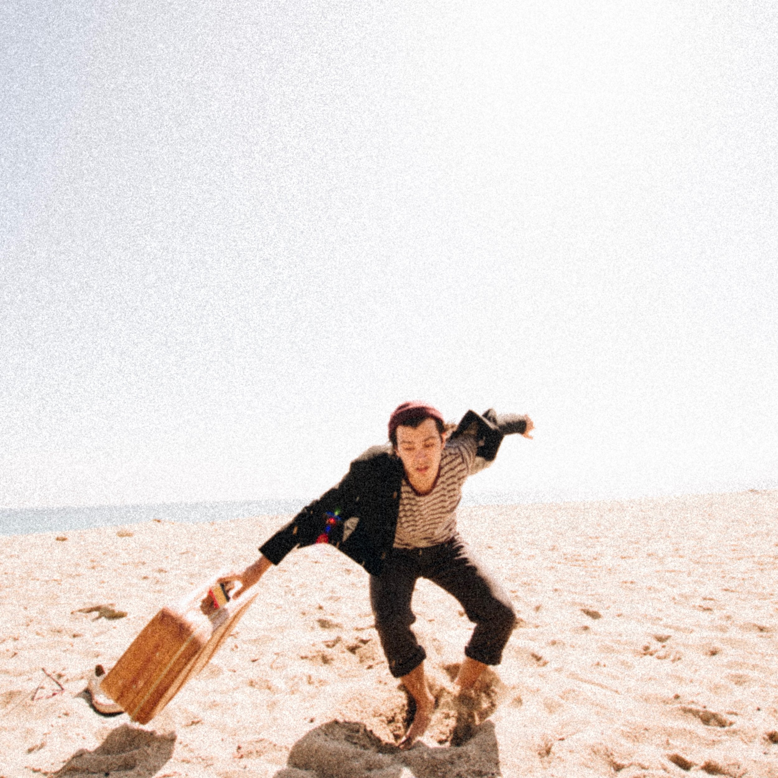 suit and suitcase beach.jpeg