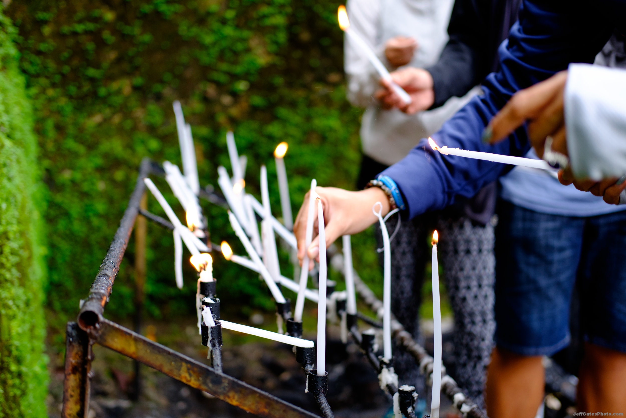 Lighting Candles at the Ruined Church